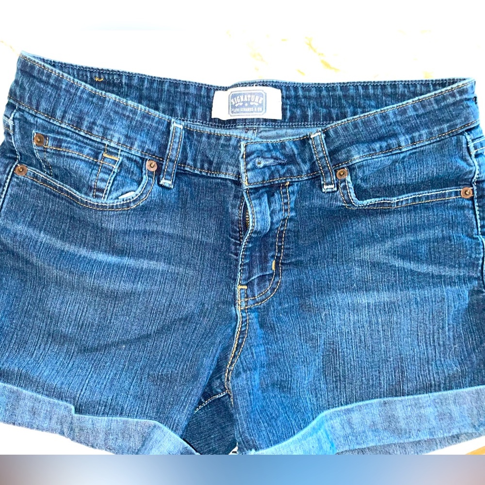 Levi’s signature rolled hem jean shorts.